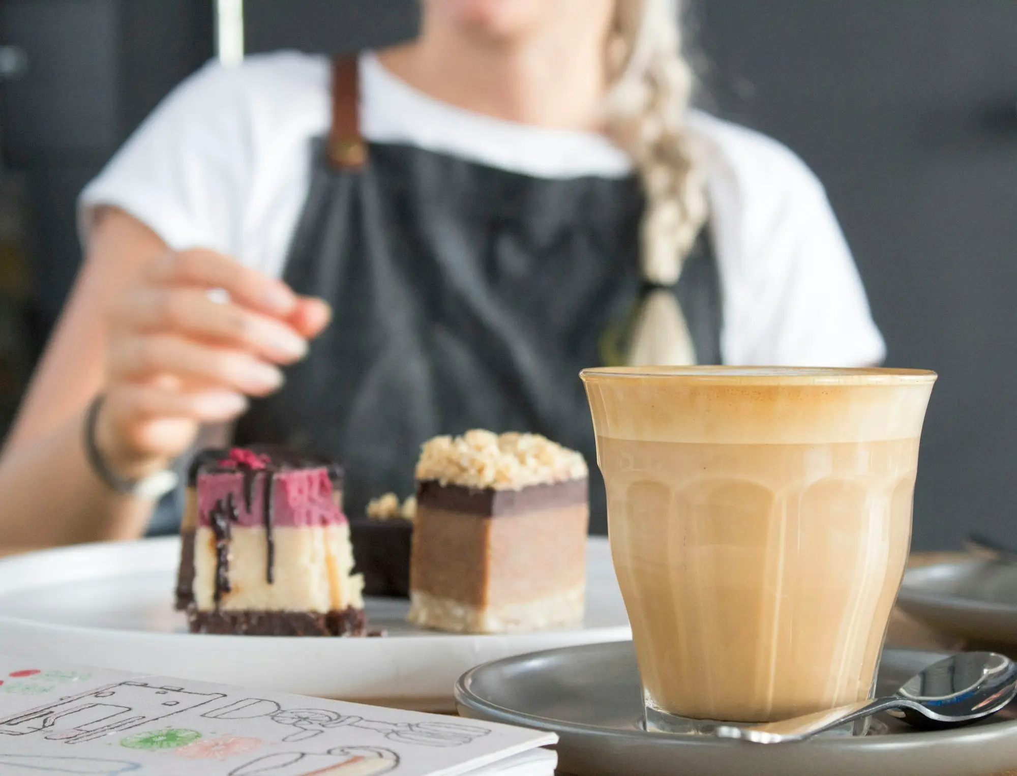 Cafe counter with cakes and a coffee machine ready for the morning trade