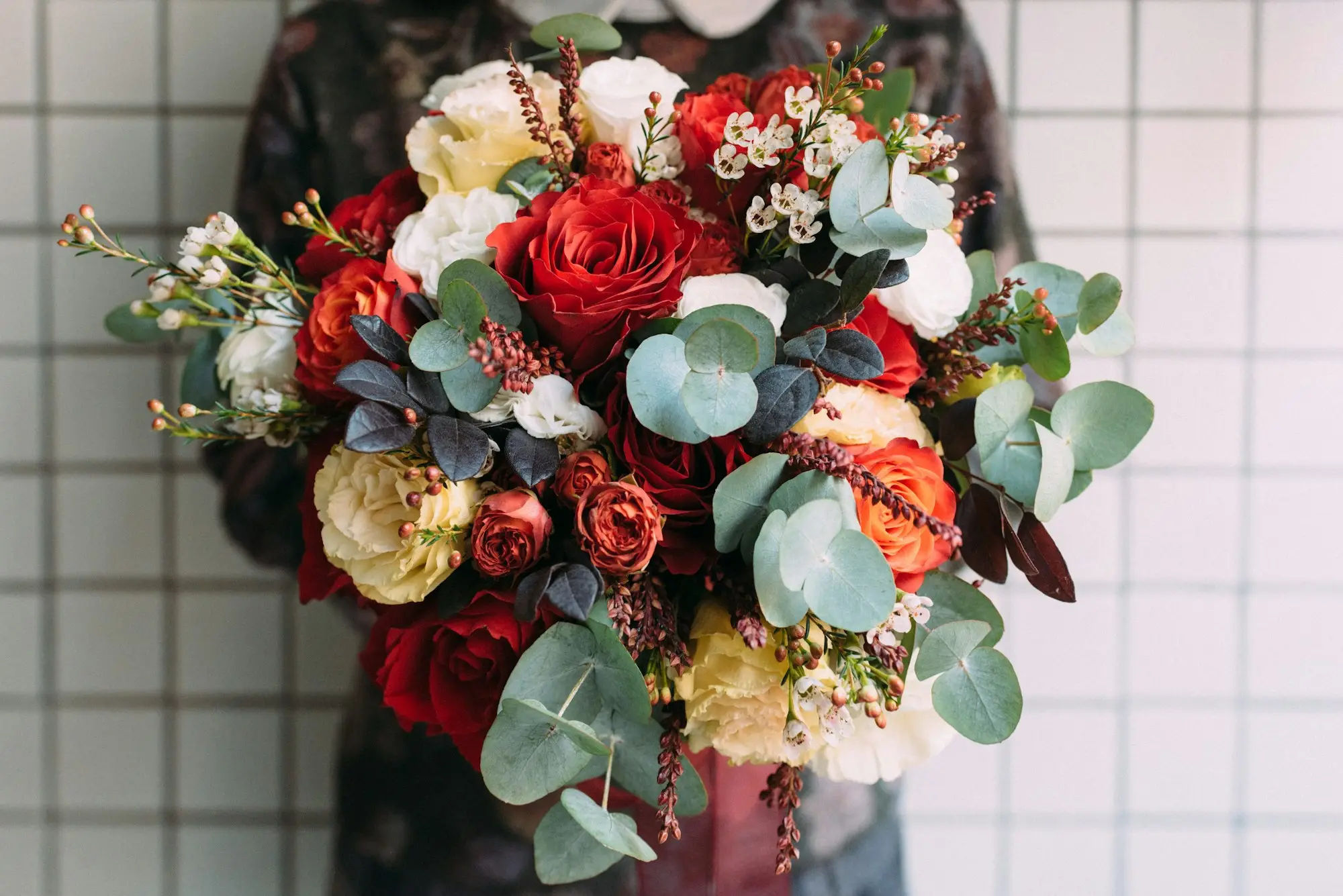 Florist holding a freshly made bouquet